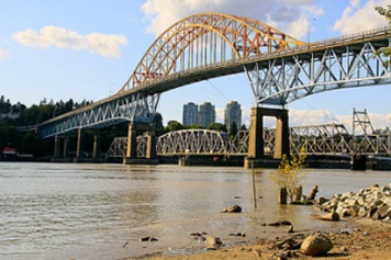 Photo of the view of the Patullo and railway bridges from Brownsville Bar Park in North Surrey, B.C. Photo credit: waferboard (Creative Commons)