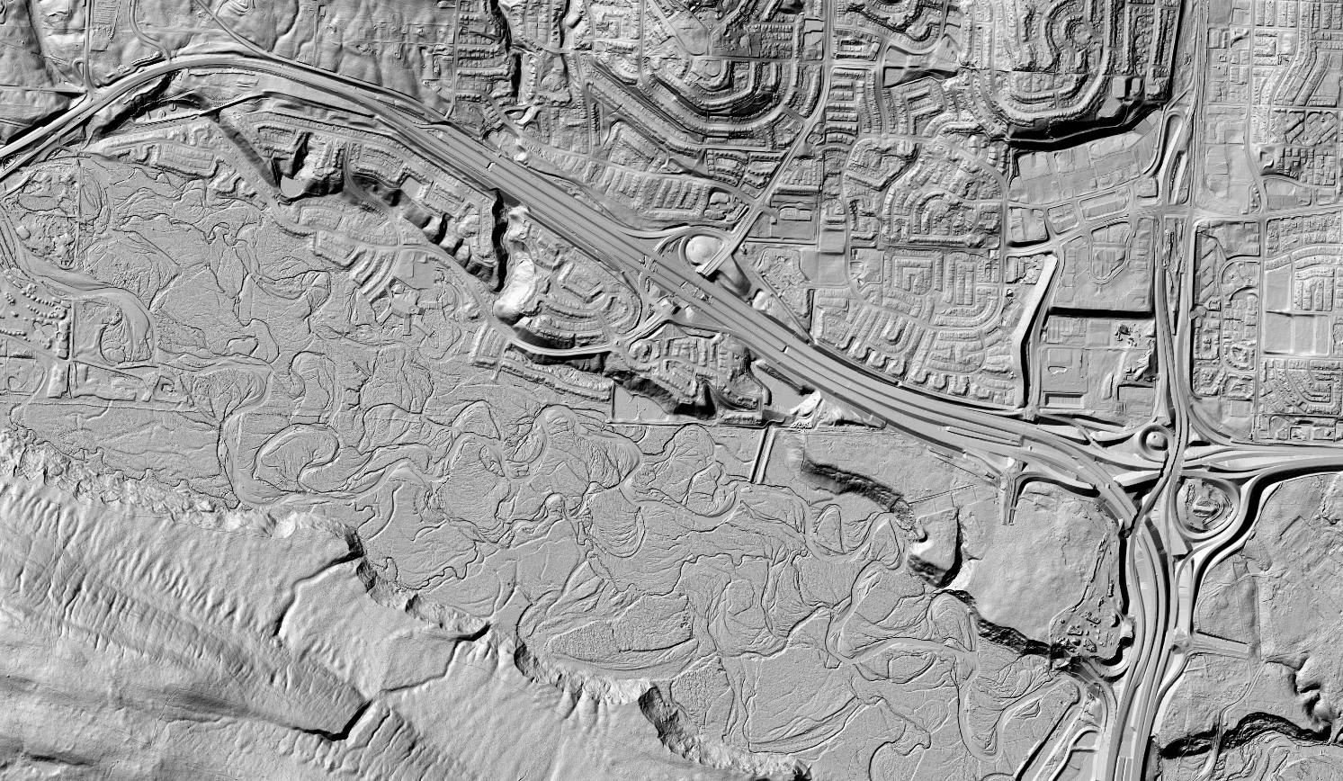 Reliefs 3D ombrés du Modèle numérique de surface (Image du haut) et du Modèle numérique de terrain (Image du bas) couvrant un secteur de la ville de Calgary, AB.